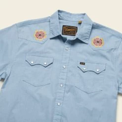 HOWLER MEN'S Crosscut Deluxe Shortsleeve Shirt -Western Fashion S23 SS Shirts Crosscut Deluxe SS Beach Blooms Blue Chambray Angle