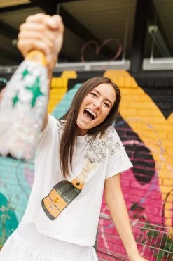 QUEEN OF SPARKLES WHITE CHAMPAGNE TEE -Western Fashion image 720x d590a1d6 606a 492d b313 fd220337358c